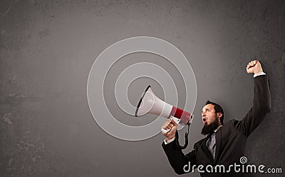 Guy shouting into megaphone on copy space
