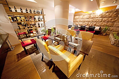 Hall with leather chairs near bar