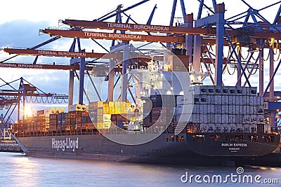 Hamburg - Container vessel at terminal in the evening