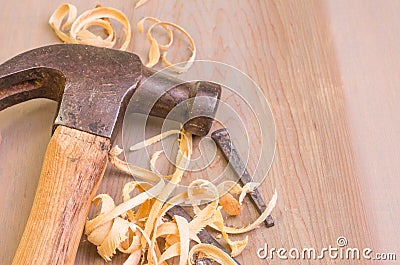 Hammer and nails on a wood board