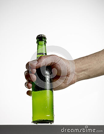 Hand with beer bottle