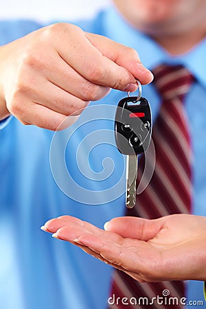 Hand with a car key.