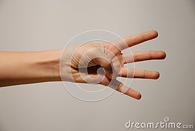 Hand and four fingers extended