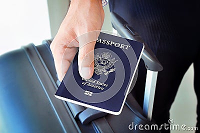 Hand giving U.S. passport