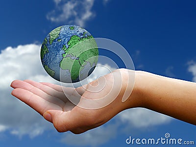 Hand holding globe