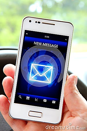 Hand holding smartphone with message on screen