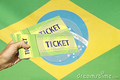 Hand Holding Two Tickets Brazilian Flag