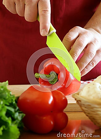 Hand man chef cooking vegetable salad