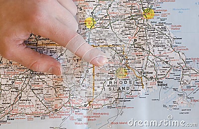 Hand pointing to map finding directions