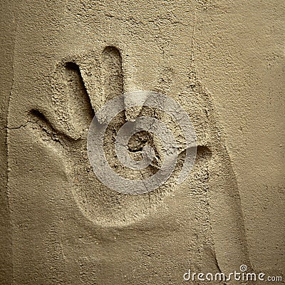 Hand print on cement mortar wall