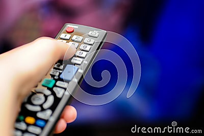 Hand with tv remote control