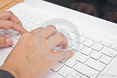Hand typing laptops key board.