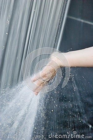 Hand in the water spray