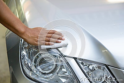 Hand with a wipe the car polishing