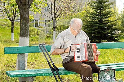 Handicapped man playing the accordion