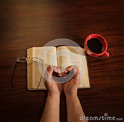 Hands With Coffee and Bible