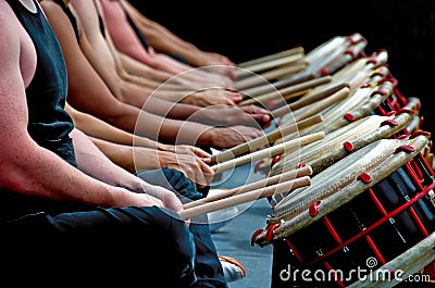 Hands, drum sticks and drums