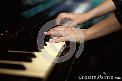 Hands playing music on the piano
