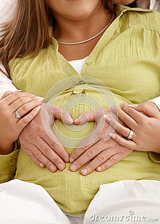 Hands on pregnant belly