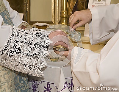 Hands of priest by the mass
