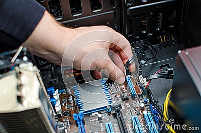 Hands of technician installing HDD