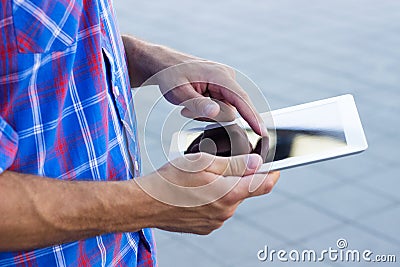 Hands using digital tablet