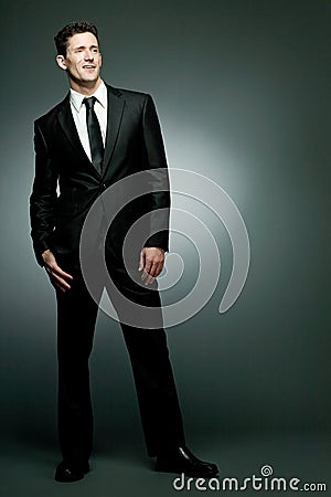 Handsome businessman in black suit.