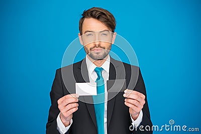 Handsome businessman showing blank business card