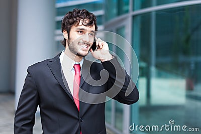 Handsome businessman talking on the phone