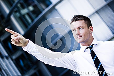 Handsome Man In A Corporate Attire Pointing Up