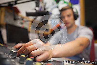 Handsome radio host moderating touching switch