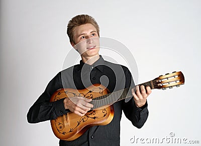 Handsome singing man playing guitar