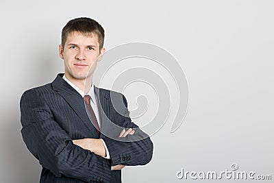 Handsome smiling young businessman.