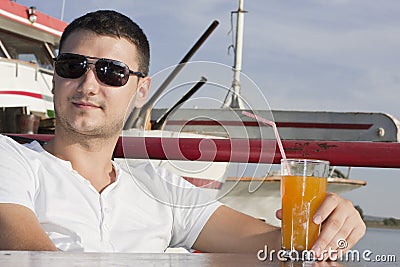 Handsome young man on boat
