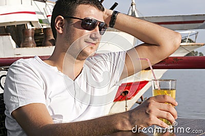 Handsome young man on boat