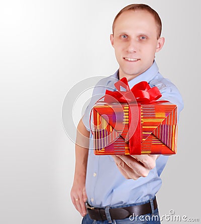 Handsome young man with gift box