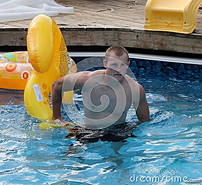 Handsome Young man in pool