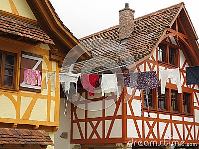 Hanging clothes between houses setting