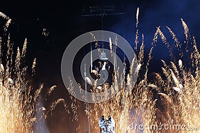 Hanging man with fireworks at background for new year’s first