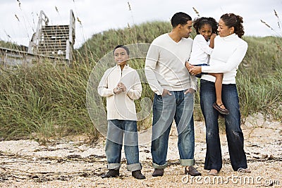 Happy African-American family standing together