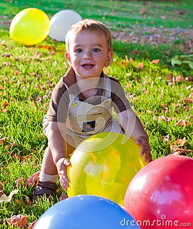 Happy Baby boy with balloons