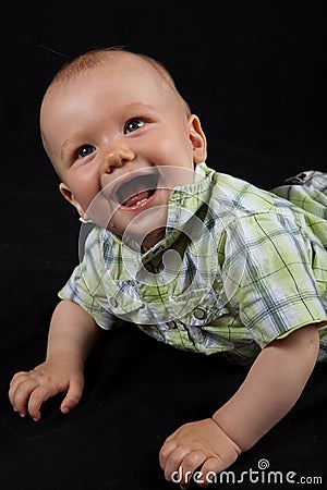 Happy Baby Boy on a Black Background