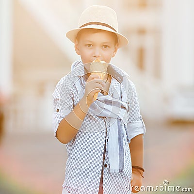 Happy baby boy eating ice cream