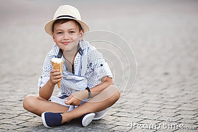 Happy baby boy eating ice cream