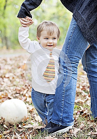 Happy baby holding on to parent