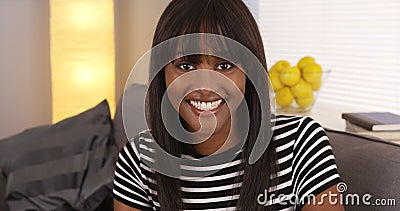 Happy black woman smiling at camera