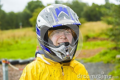 Happy boy with helmet at the kart trail