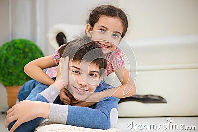 Happy brother and sister at home