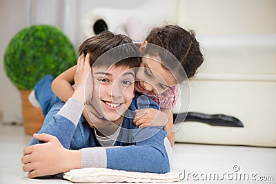 Happy brother and sister at home