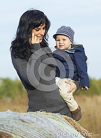 Happy business mother with little boy